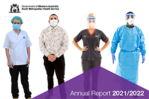Four people stand together and each wears a mask. From left; a woman wears a white tunic and hair net; a man wears office clothes; a woman wears nursing scrubs and a man wears full personal protective equipment. Text reads Annual Report  2021/22